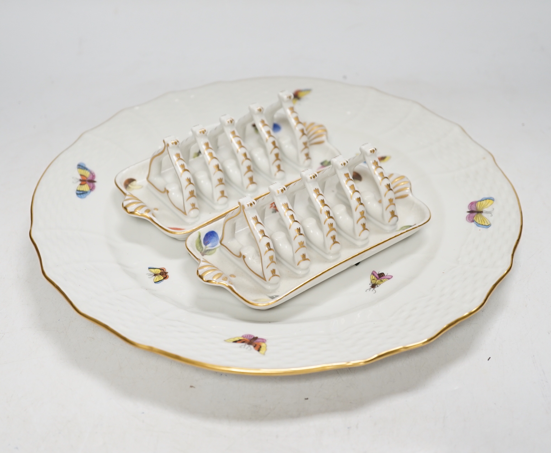 A group of Herend Rothschild 'birds' pattern decorative wares, and two Herend fruit pattern toast racks